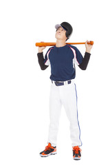 Young adult baseball player holding bat and thinking