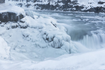 Partially frozen waterfall Gulfoss, Iceland in wintertime