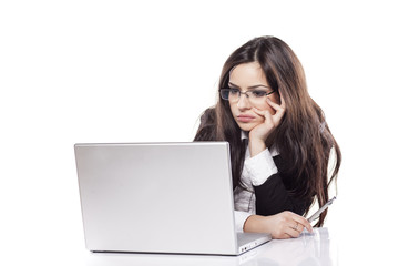 young business woman reading boring content on her laptop