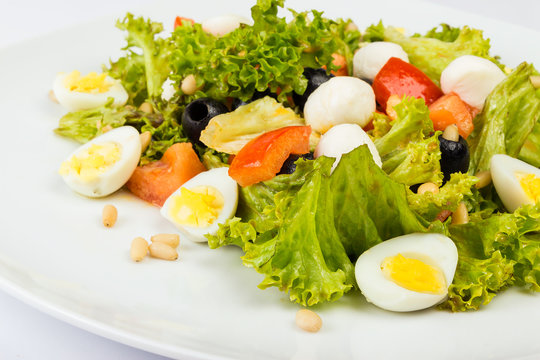 salad with quail eggs and pepper