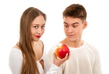 Beautiful young couple with apple