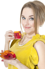 Dreamy woman with cup of coffee on a plate, isolated on white ba