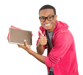Excited, happy student holding books, showing thumbs up
