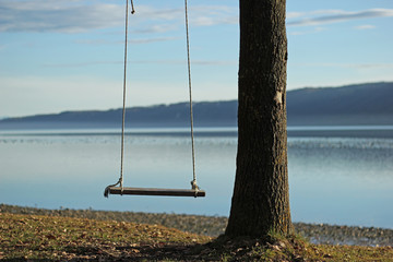 Empty swing during sunset