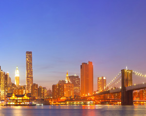 Fototapeta na wymiar New York City USA, lights on buildings during sunset
