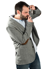 Man photographing over white background