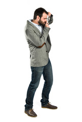 Man photographing over white background