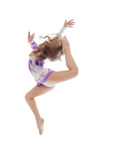 Fototapeta premium Graceful little artistic gymnast posing in jump