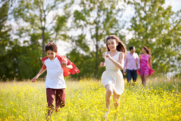 Hispanic Family Walking In Countryside