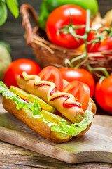 Closeup of homemade hot dog with fresh vegetables