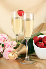 Romantic still life with champagne, strawberry and pink roses,