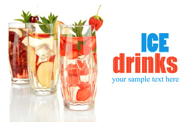 Glasses of fruit drinks with ice cubes isolated on white