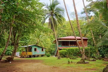 Keuken spatwand met foto Caribbean house and hut with tropical vegetation © dam