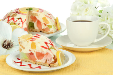Delicious jelly cake on table on white background