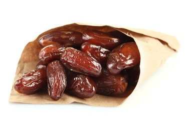 Dried dates in paper cone isolated on white