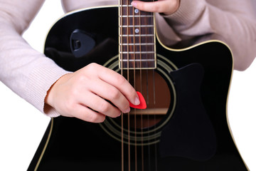 Fototapeta premium Acoustic guitar in female hands, close-up