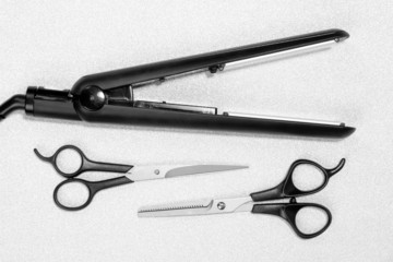 Hairdressing tools on silver background