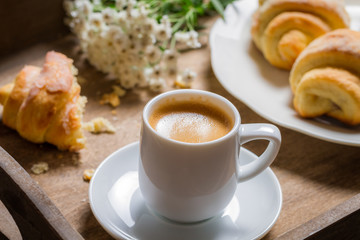 Breakfast to bed with hot coffee and a croissant