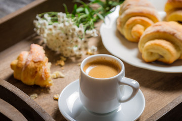 Breakfast to bed with hot coffee and flowers