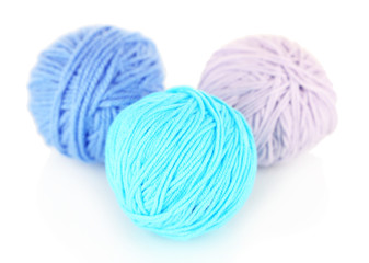 Balls of wool on wooden table background