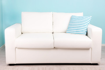 White sofa in room on blue background