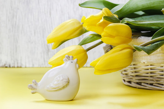 Beautiful yellow tulips and ceramic hen - spring and easter symb