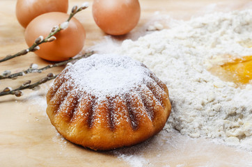 Easter yeast cake on wooden kitchen board