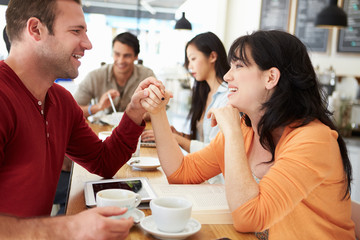 Romantic Couple Meeting In Busy Café