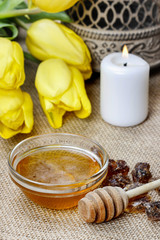 Bowl of honey on wooden table. Symbol of healthy living
