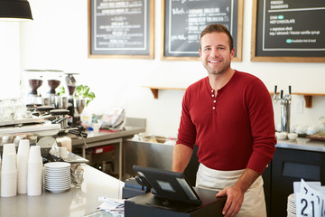 Customer Paying In Coffee Shop Using Touchscreen - obrazy, fototapety, plakaty