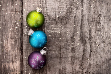 Christmas decoration ball on textured grungy wooden surface