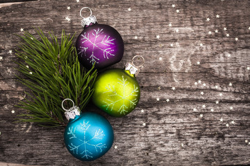 Christmas decoration ball on textured grungy wooden surface