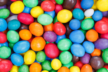 Fototapeta na wymiar multi-colored chocolate candy dragees