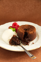 Chocolate fondant (pudding) with raspberries.