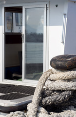 White boat open glass door bollard dock