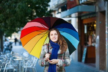 Girl in autumn jacket  with umbrella