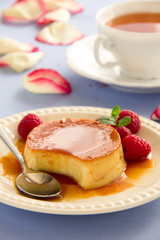 Creme caramel with raspberries.