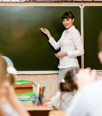 teacher teaches students in classroom