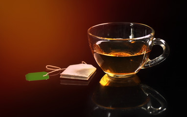Cup of tea on black background