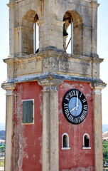 Old tower clock and the town of Corfu, Greece, Europe