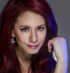 Portrait of young woman thinking red hair