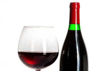 Wine bottle and a glass filled with wine isolated on white