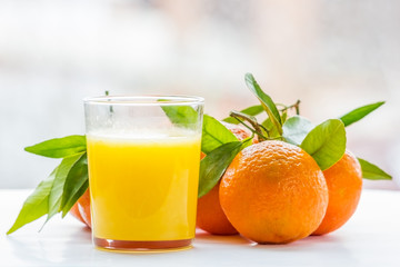 Tangerines and glass of juice