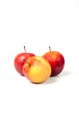 three isolated apples with water drops