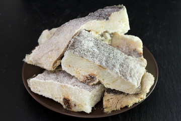 salted dry codfish on brown plate