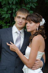 Just Married couple embracing outdoors