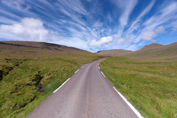 Empty road running through unspoilt nature