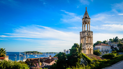 Old church bell tower on the island of Hvar in Dalmatia - obrazy, fototapety, plakaty