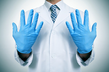 a doctor with medical gloves
