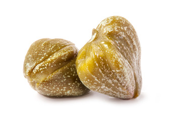 Two capers isolated on white background